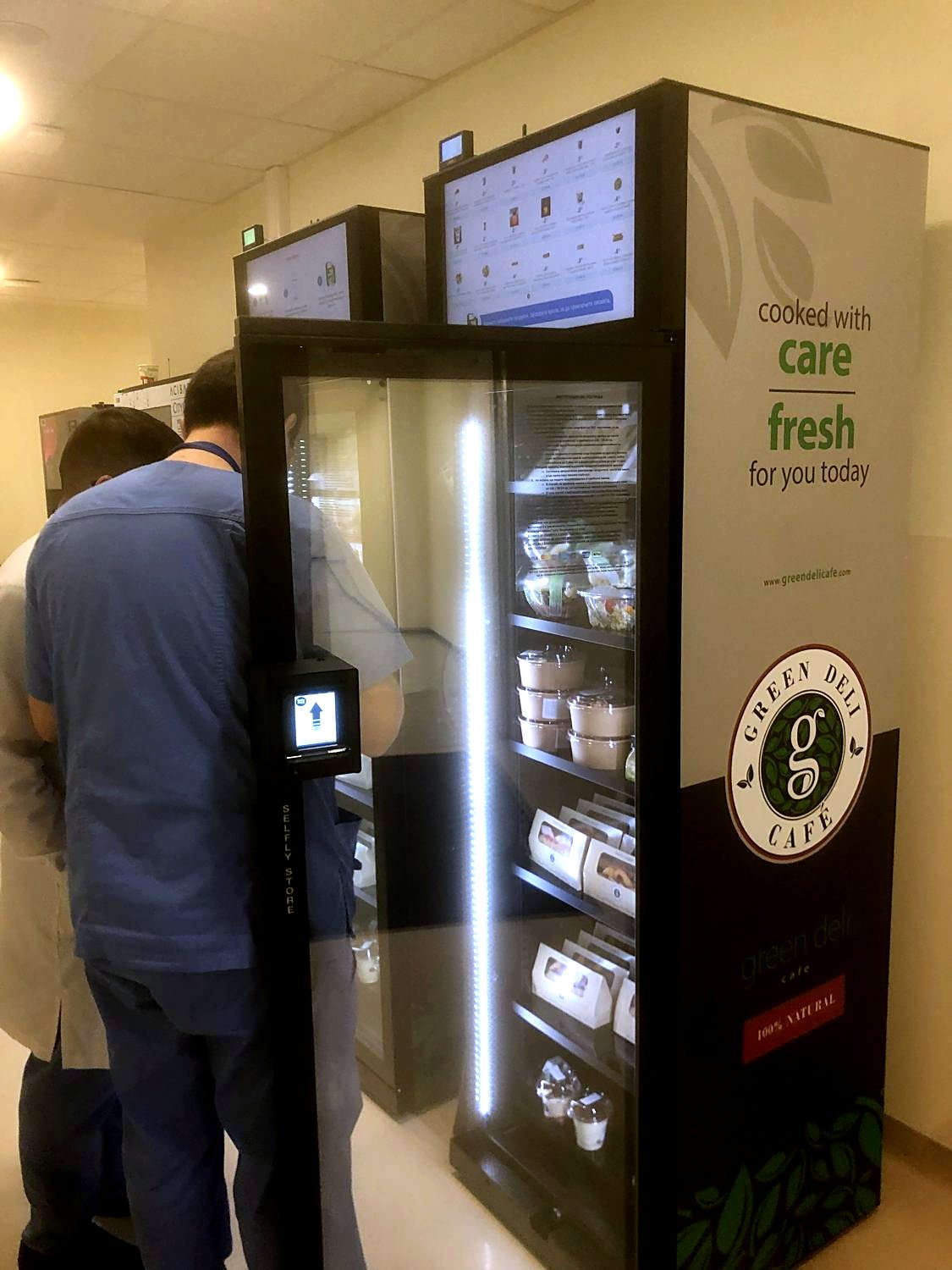 An employee taking food from a fridge at Acibadem City Clinic